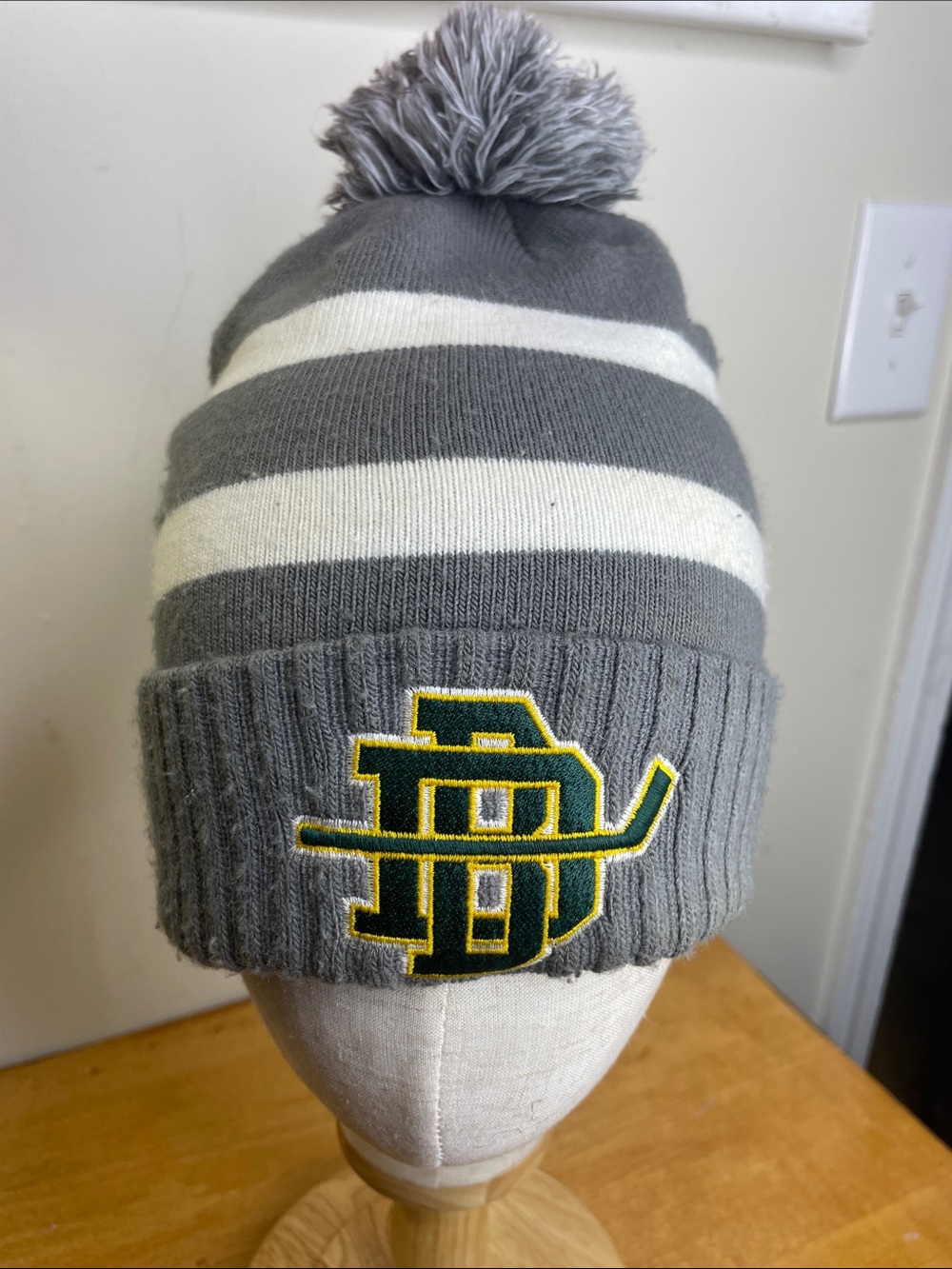 Under Armour Gray & White Striped Pom Beanie with Green and Yellow Logo
